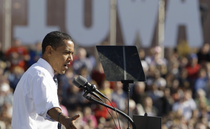 In October 2008, then-Democratic presidential candidate Sen. Barack Obama spoke at a rally in Des Moines, Iowa. Now, even without a Democratic challenger, President Obama plans aggressive roles in states with early presidential primaries, especially in Iowa and other battleground states.