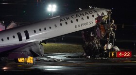 An Air Canada Jet sits on the runway at LaGuardia Airport, Monday, March 23, 2026, after colliding with a Port Authority aircraft rescue and firefighting vehicle after landing in New York.