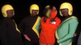 Two of the men with their faces painted black and dressed as the Jamaican bobsled team from the 1993 movie "Cool Runnings" are allegedly teachers are Junipero Serra High School.