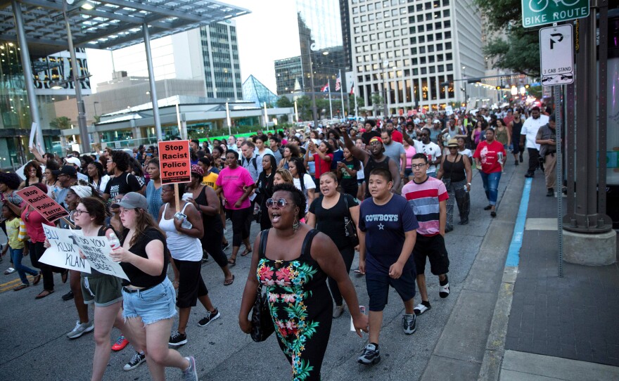 People rally in Dallas on Thursday to protest the deaths of Alton Sterling and Philando Castile.