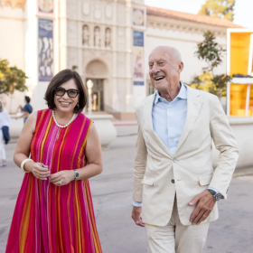 San Diego Museum of Art executive director and CEO Roxana Velásquez (left) walks alongside architect and Foster+Partners founder Norman Foster in Balboa Park, Sept. 9, 2024.