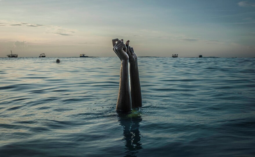 Swim instructor Chema snaps her fingers as she disappears underwater on Dec. 28, 2016, in Nungwi, Zanzibar. "It was fulfilling to photograph alongside a group of women swim instructors who are supporting positive change for women and girls in the archipelago," says photographer Anna Boyiazis.