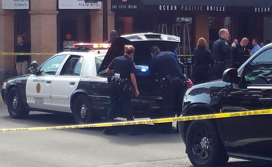 San Diego police investigate an officer-involved shooting at Sixth Avenue and F Street in the Gaslamp Quarter, Oct. 20, 2015.