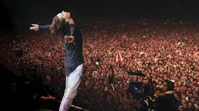Michael Hutchence, lead singer of INXS, performs with the band at Wembley Stadium in London. July 13, 1991.