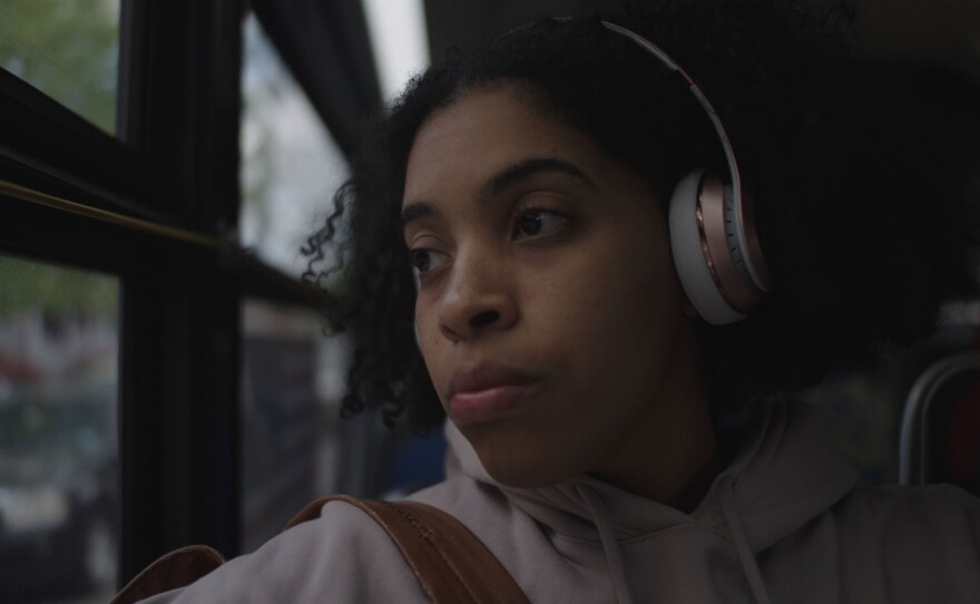 Alexandra Perez on the bus as she used to take as a child that passes by Albert Einstein College of Medicine where she would later attend.