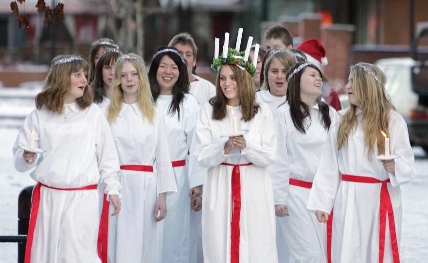 On Santa Lucia Day in Sweden, it's tradition to dress as the Sicilian saint and serve coffee and lussebullar (saffron buns) in her honor.
