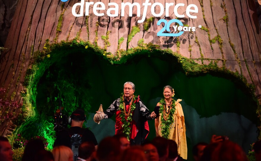 Danny Akaka Jr. and Anna Akaka address attendees during Salesforce's 2022 Dreamforce conference in San Francisco. Danny, the son of late U.S. Sen. Daniel Akaka, and Anna have been spiritual advisers to Benioff.