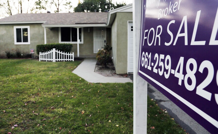 A sign announces that a Los Angeles house is for sale in November.
