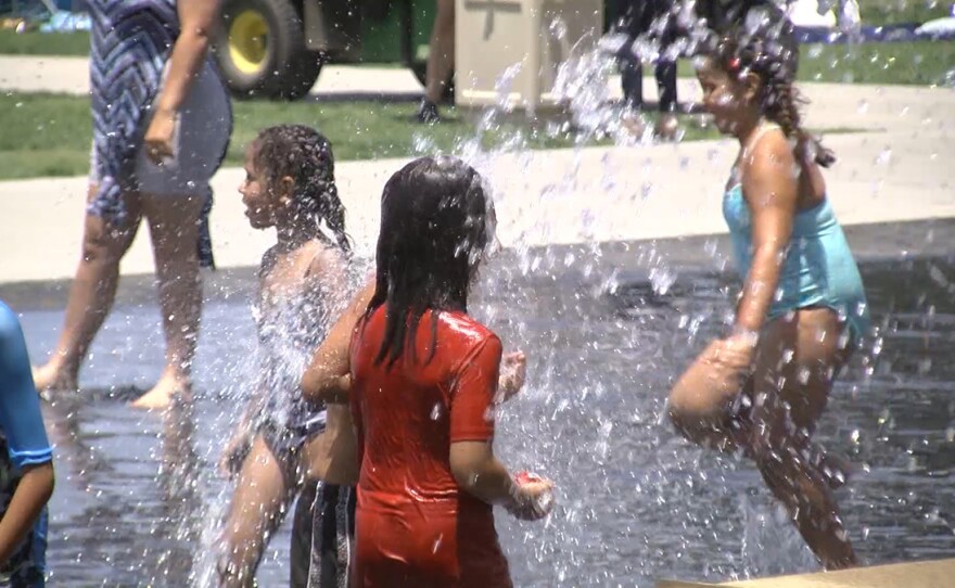 Children playing in the fountain in front of the County Administration Building in downtown San Diego on July 23, 2019.