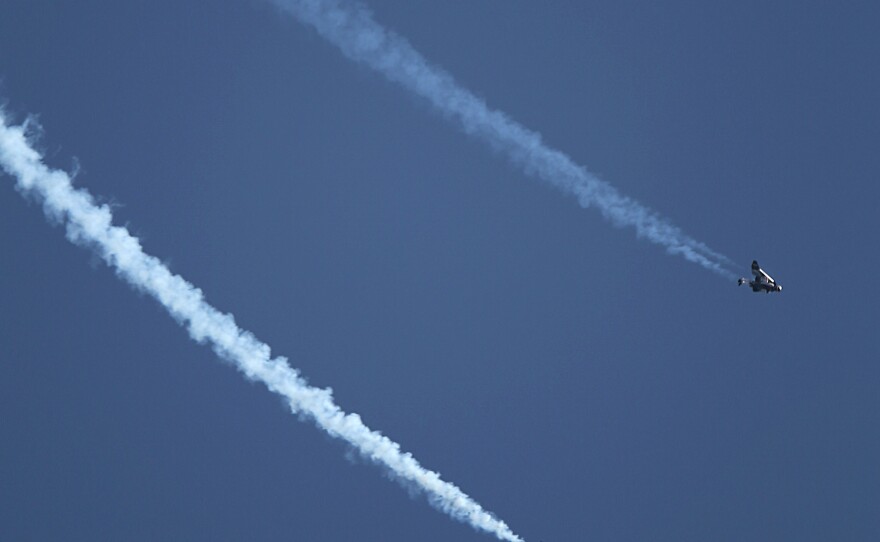 Rossy and his protege, Vincent Reffet, fly over Dubai's Palm Island.