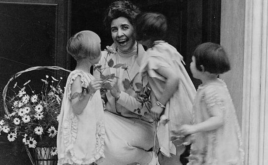 First Lady Grace Coolidge receives a May-basket from young children in 1927.