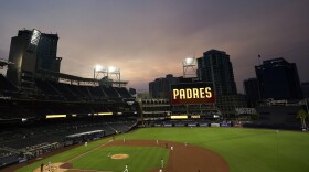 Smoke from California wildfires mixes with low clouds as the San Diego Padres play the Colorado Rockies in a baseball game at Petco Park Wednesday, Sept. 9, 2020, in San Diego.
