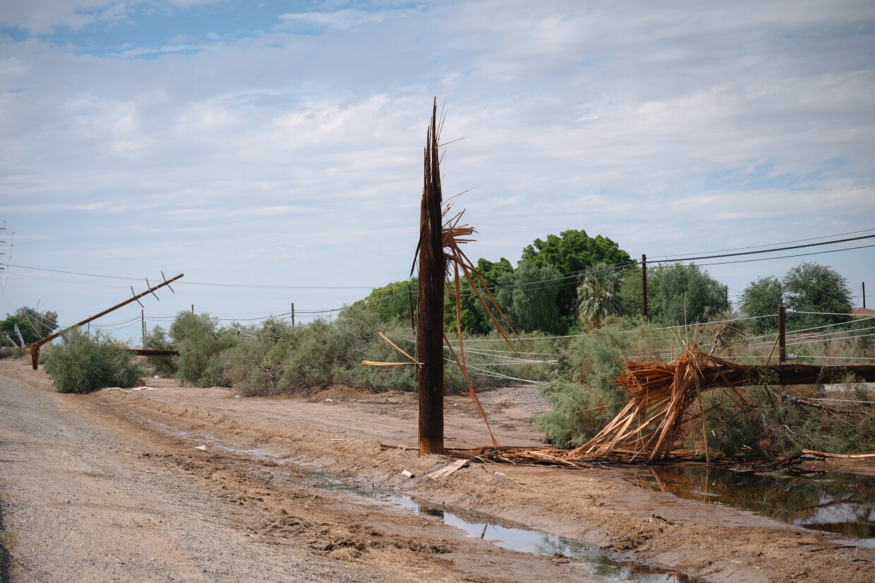 Splintered power poles sit along the Evan Hewes Highway between El Centro and Holtville following a major storm in Imperial County on September 22, 2025.
