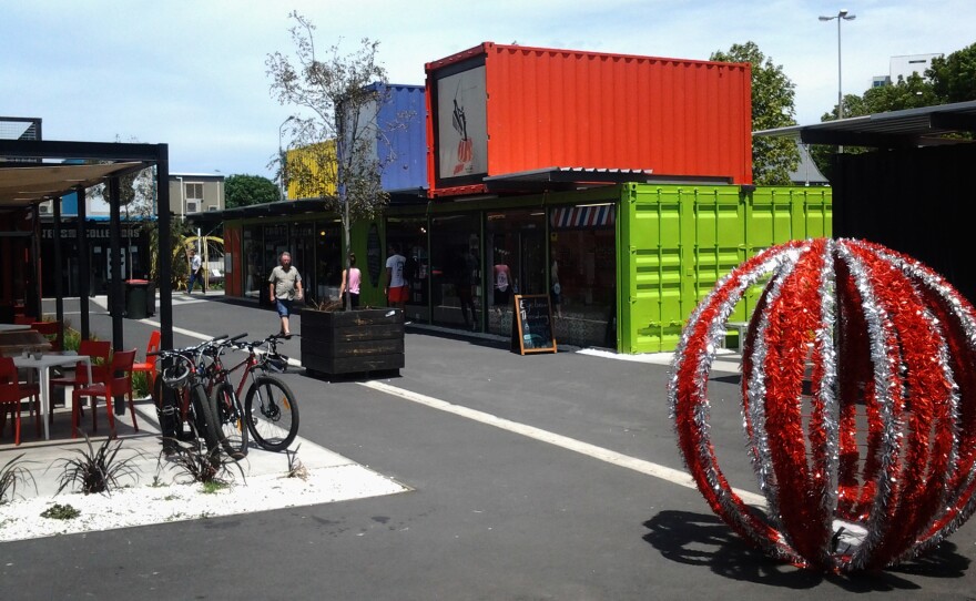 Pop-up stores and cafes in shipping containers cheer up the center of the earthquake-battered city.