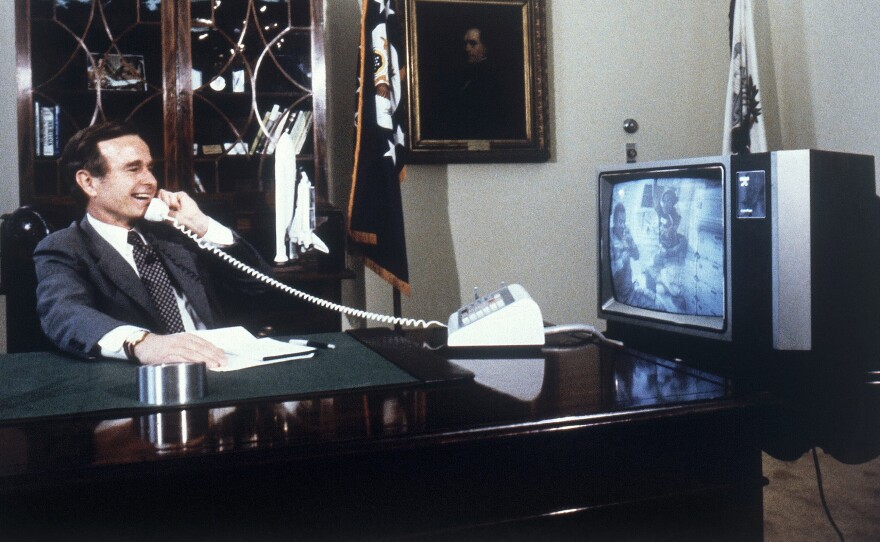 George H.W. Bush speaks with space shuttle astronauts in 1981.