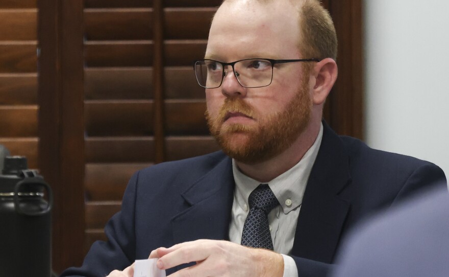 Travis McMichael, his father and a family friend are facing murder charges over the killing of Ahmaud Arbery in February of 2020. He's seen here in a courthouse in Brunswick, Ga.