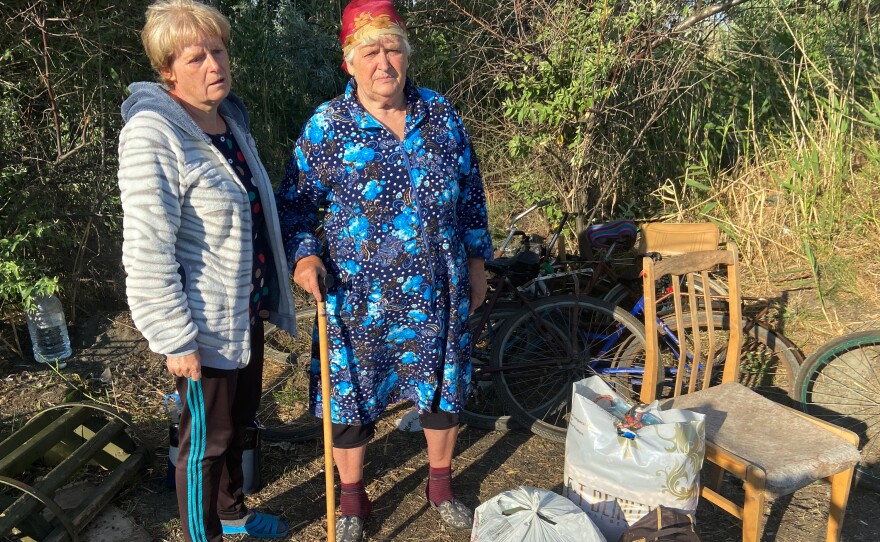 Inna Kravchenko, 52, and her mother, Raïsa Kozlova, 75, moments after crossing by bike from Russian-occupied territory in the Kherson region to the Ukrainian-controlled village of Zelenodolsk. They were able to bring three bags of belongings but fear their house they left behind will be destroyed by Russian soldiers.