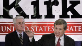 Former Illinois Gov. Jim Edgar (left) looks on as Senate candidate Mark Kirk campaigns in Springfield, Ill., last July.