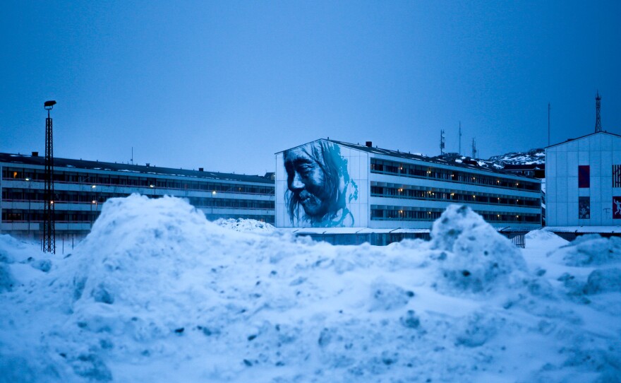 Apartment blocks dominate central Nuuk. A mural commissioned by the city is a large-scale reproduction of a photograph from the early 1900s.