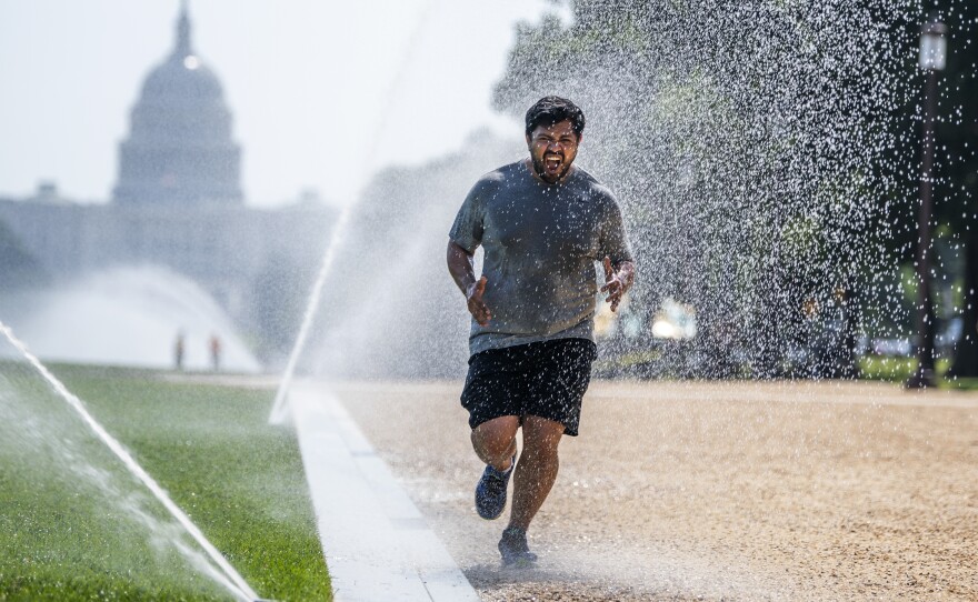 If you must exercise when the the sun is high, dousing yourself with water, as this jogger did last month in steamy Washington, D.C., could help cool you down.