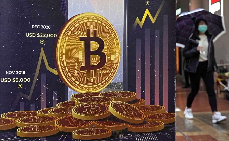 An advertisement for Bitcoin cryptocurrency is displayed on a street in Hong Kong, on Feb. 17, 2022.