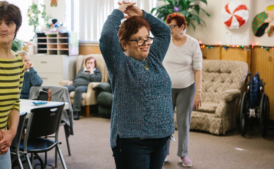 Pauline dances along to a video during a morning exercise routine at the Arc Northeastern Pennsylvania.