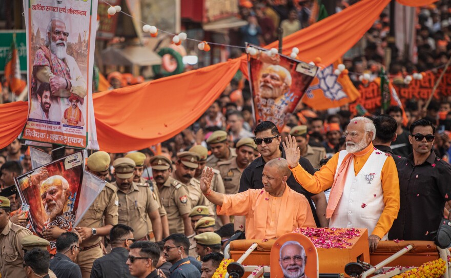 Indian Prime Minister Narendra Modi waves to supporters on May 13 in Varanasi, India.