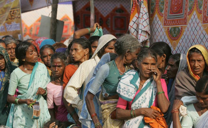 Lower-caste Dalit women wait for medical treatment in Mumbai on Dec. 6, 2006.
