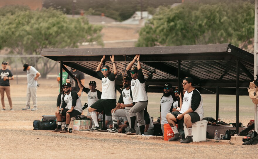 Texas Dingers players await their turns at bat.