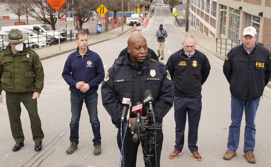 Nashville Police Chief John Drake, center, speaks during a news conference on Christmas Day in Nashville. Law enforcement is looking into who and how many may have been involved in a bombing in the city's downtown corridor.