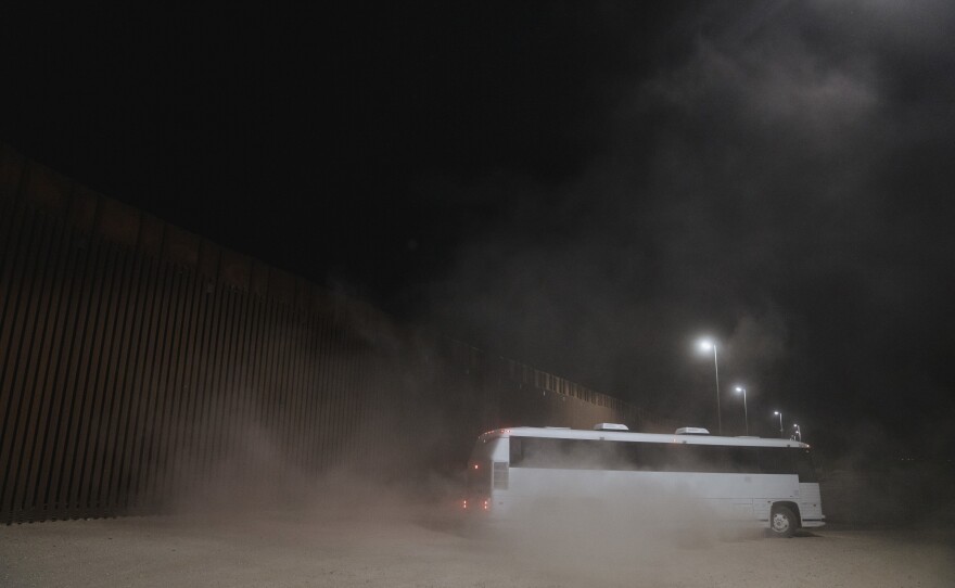 A bus carrying migrants surrendered to U.S. Border Patrol agents in Yuma, Ariz., on Thursday.