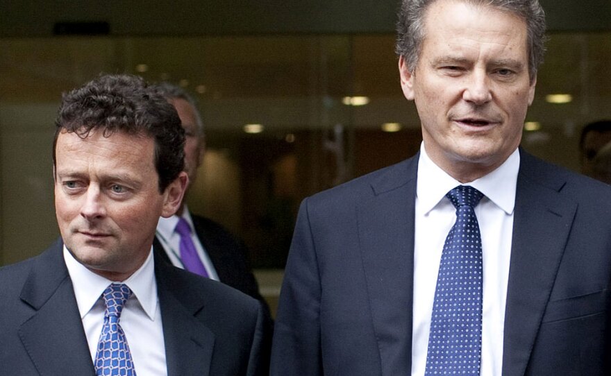 BP Chairman Carl-Henric Svanberg (right) stands with outgoing CEO Tony Hayward. Hayward may not receive any exit compensation if he stays on with the company.