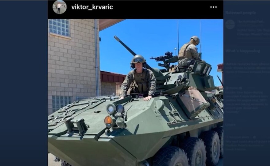 A screenshot from Victor Krvaric's Instagram page shows him in full military gear, with his upper body sticking out from a tank in this undated image.