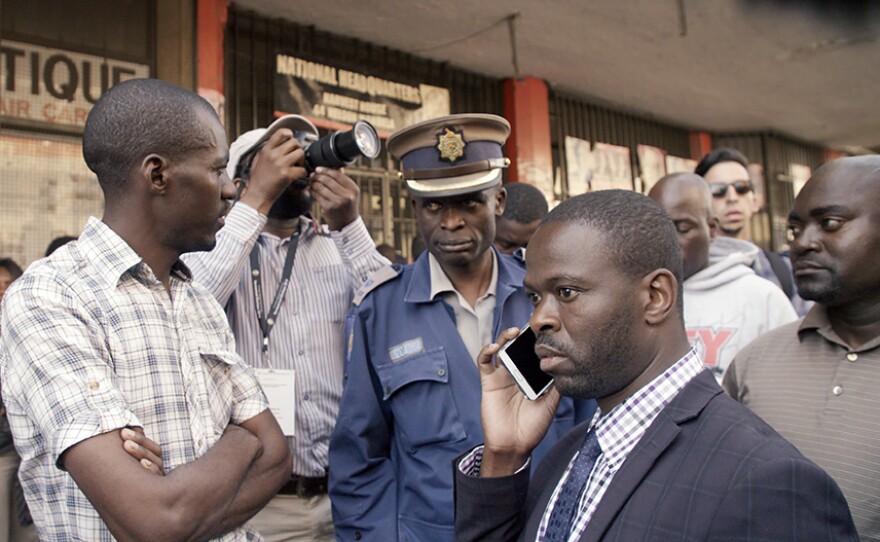 Dr. Sibanda in front of the Movement for Democratic Change (MDC) office