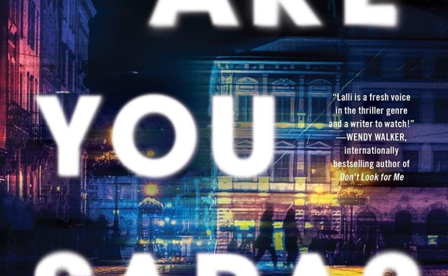 A vivid nighttime street with splashes of colored light. Title in bold white text.