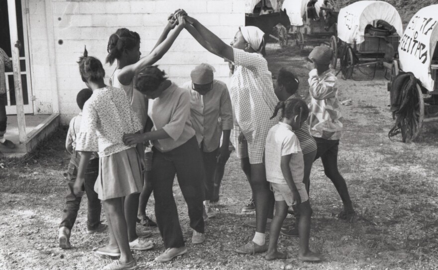 Girls play Ride-Sally-Ride in Duck Hill, Miss., on May 20.