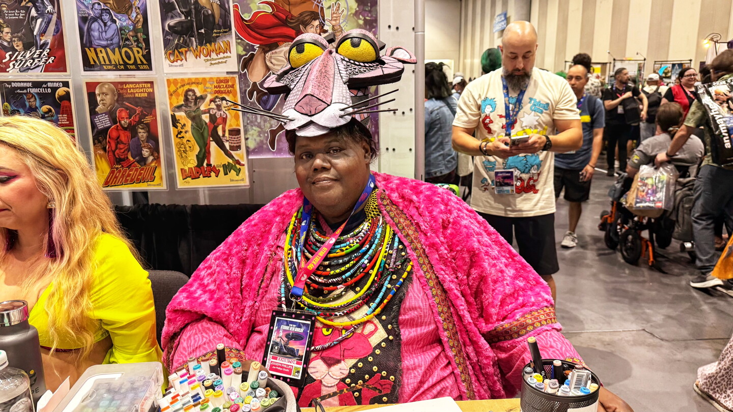 A Pink Panther cosplayer works a vendor booth at Comic-Con, July, 26, 2026.