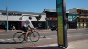 A cyclist rides past a bike counter on 30th Street in North Park, Jan. 30, 2026.