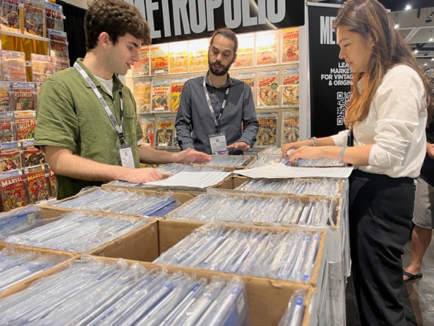 People work at the ComicConnect booth on July 28, 2024. San Diego Convention Center.