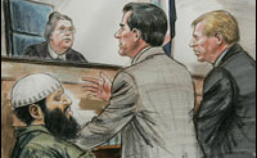 A sketch shows confessed al-Qaida conspirator Zacarias Moussaoui in court as defense attorney Edward MacMahon (center) and prosecution counsel David Novak (right) speak with U.S. District Judge Leonie Brinkema on March 13, 2006, in Alexandria, Va.