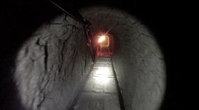 This photo released by U.S. Immigration and Customs Enforcement on Oct. 31, 2013 shows a drug-smuggling tunnel linking warehouses in Tijuana and San Diego.