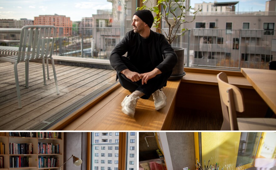 Sebastian Schublach has lived in this apartment in Vienna for six years with his wife and two kids. It's affordable, and it has climate-friendly elements like rooftop solar and good insulation. At top: Schublach sits in the building's light-filled communal kitchen and dining room. Bottom right: Art supplies in the shared art space. Bottom left: The rooftop library is available to any of the building's residents. 