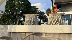 An experiment in nature-inspired design is underway in a South Florida residential canal. Two mangrove planters are being installed on a new seawall to provide habitat for marine wildlife.