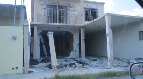 This house in Nuevo Laredo, Mexico once housed kidnap victims. The federal police raided the house and left it peppered with bullet holes. 