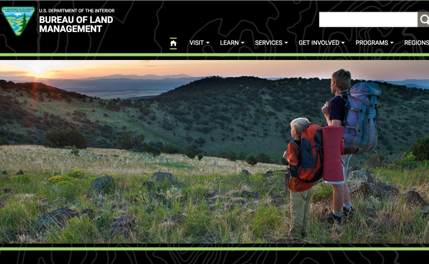 A cached version of BLM.gov from March 25 shows the Bureau of Land Management's homepage previously featured a photo of man and a boy overlooking a scenic landscape.