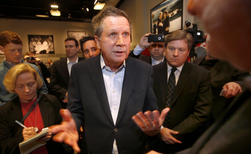 Ohio Gov. John Kasich, R-Ohio, is greeted after speaking at an event with activists and businesses in New Hampshire in March.