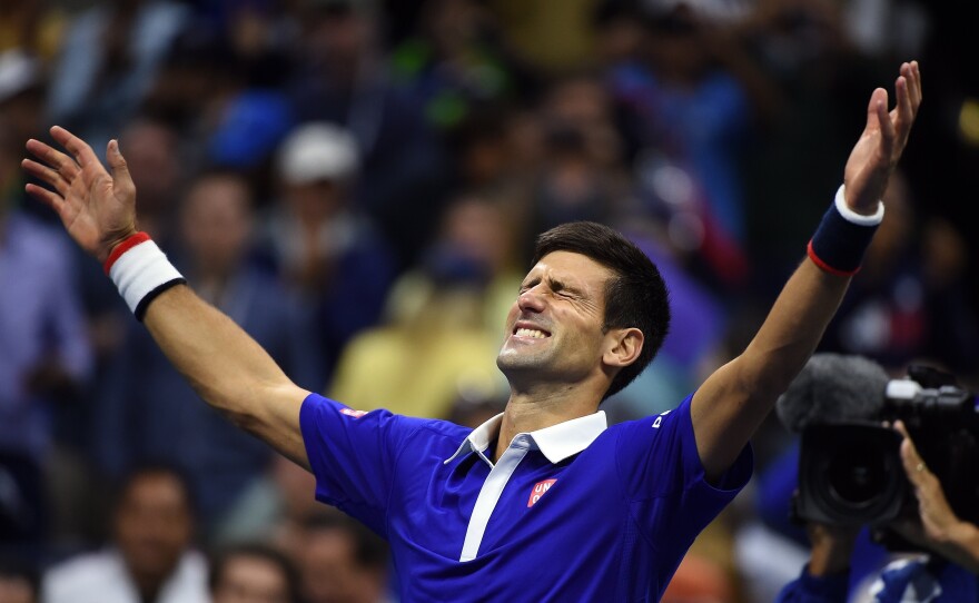 Novak Djokovic of Serbia celebrates after defeating Roger Federer of Switzerland during of their 2015 US Open Men's singles final match on Sunday.