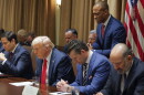 Housing and Urban Development Secretary Scott Turner prays during a Cabinet meeting with President Donald Trump at the White House in Washington on Feb. 26, 2025, as Secretary of State Marco Rubio and Defense Secretary Pete Hegseth also bows his head.