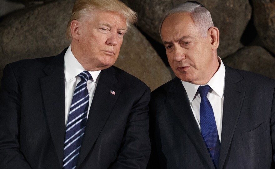 Then-President Donald Trump talks with Israeli Prime Minister Benjamin Netanyahu during a ceremony in 2017 in Jerusalem.