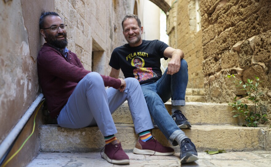 Aziz Abu Sarah and Maoz Inon sit together in old Jaffa, a mixed Israeli and Palestinian area of Tel Aviv, Jan. 11. "I lost my parents on Oct. 7, but I won a brother," says Inon of Abu Sarah. "And for me, it's not a partnership, it's not a friendship, it's a brotherhood."